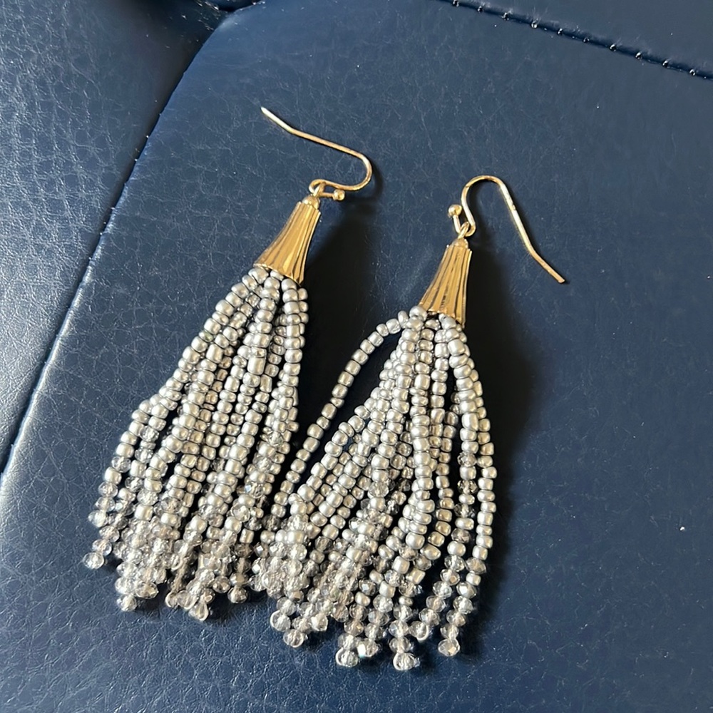 Silver beaded tassel hanging earrings.